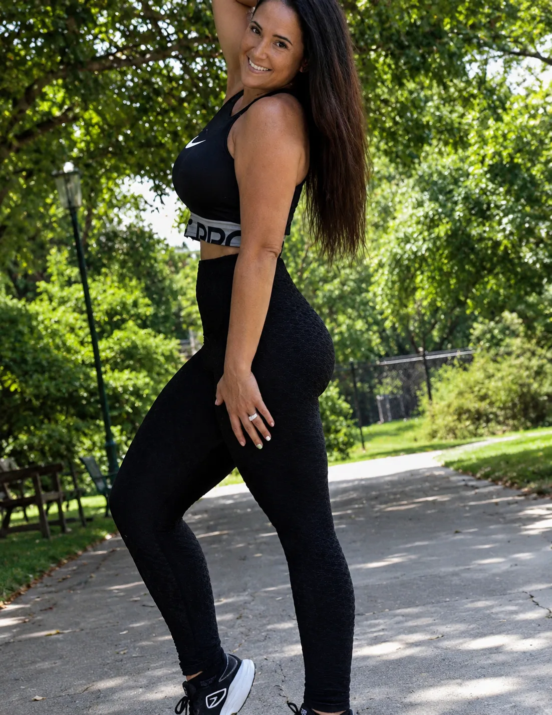 Audra Miller outdoors in black athletic clothing